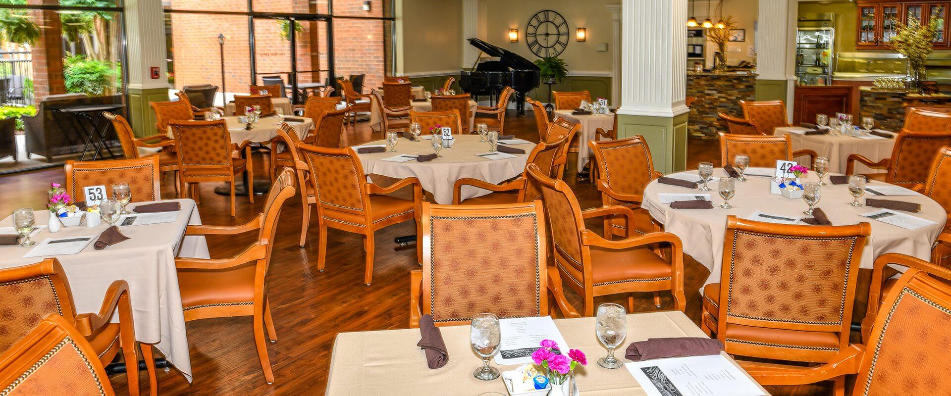 A restaurant with tables and chairs set up for dining.
