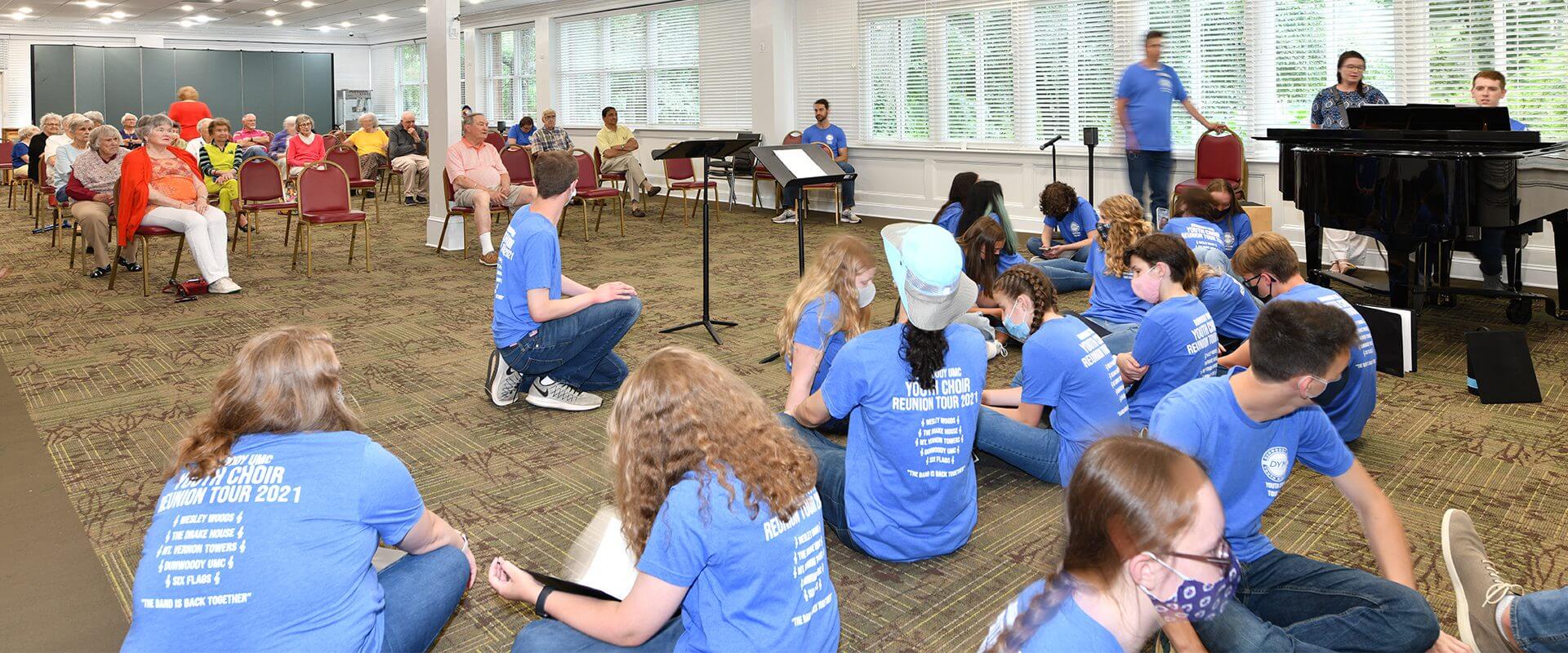 Youth music rehearsal with piano and audience