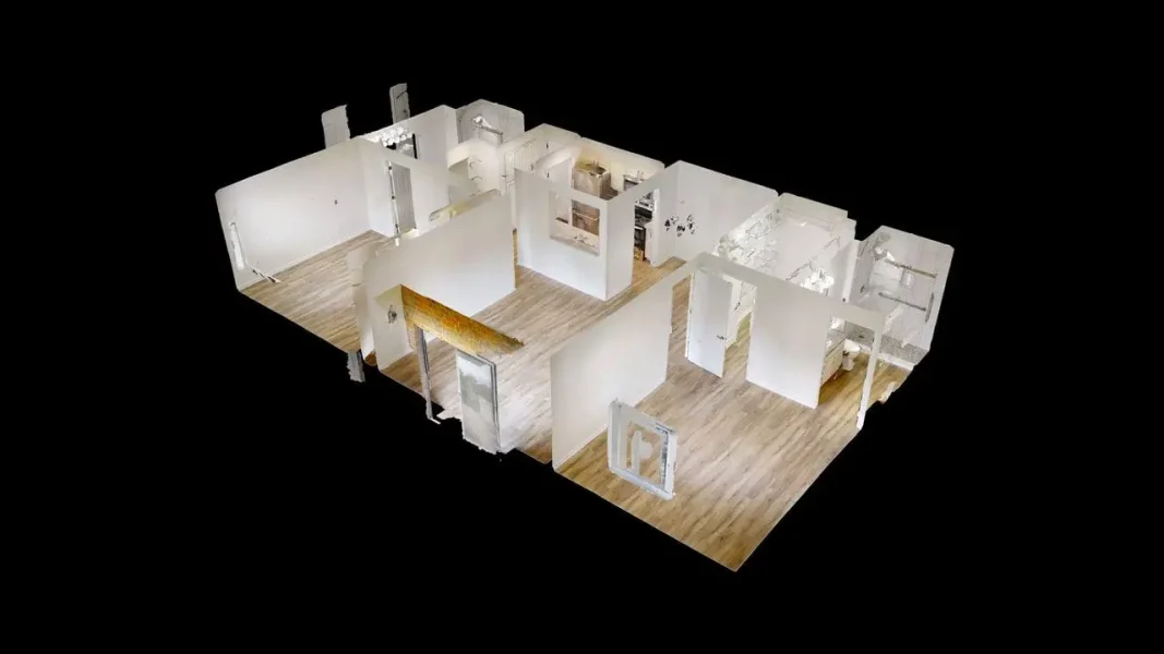 3D floor plan rendering of an office with white partition walls and light wood floors by a black background.